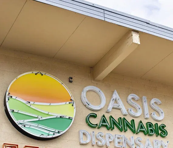 Oasis Cannabis Dispensary sign on the outside of the store