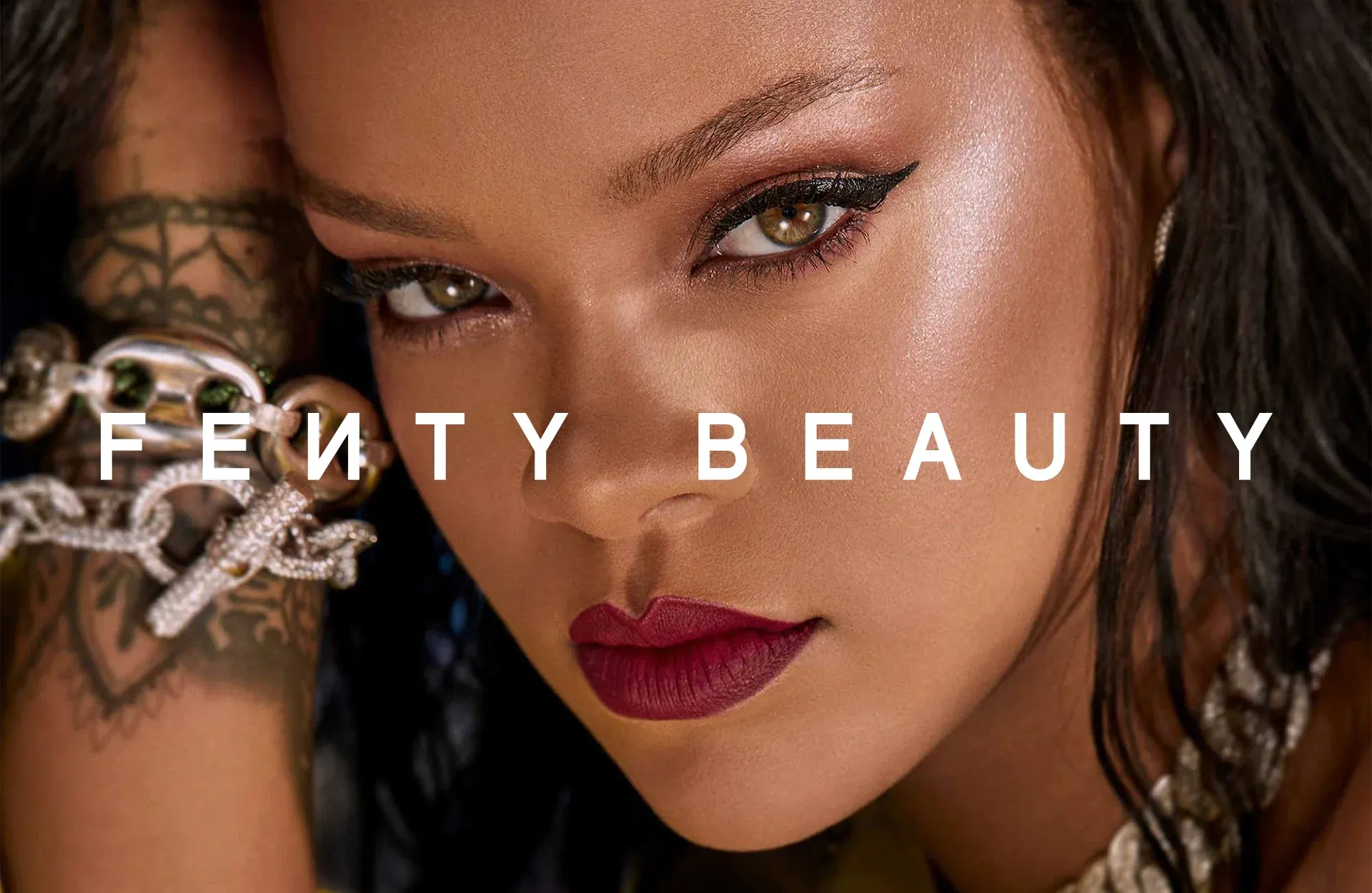 Close-up of Rihanna with the Fenty Beauty wordmark