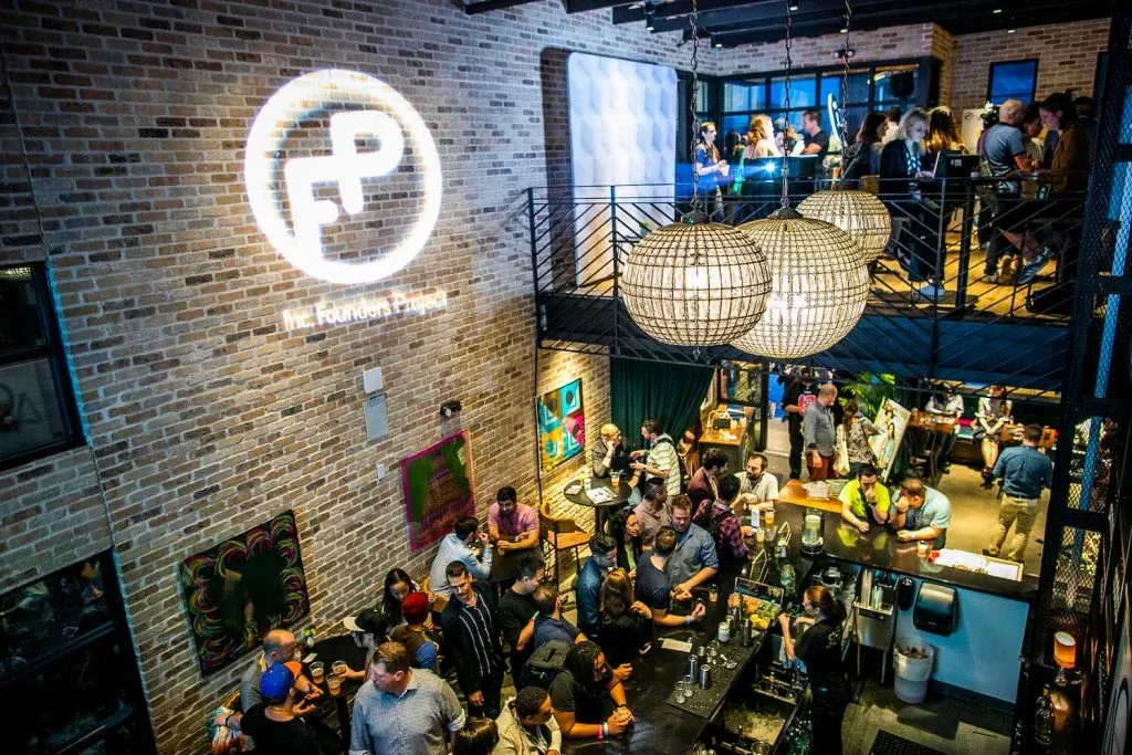A crowded happy hour at Inc. Founders House during SXSW