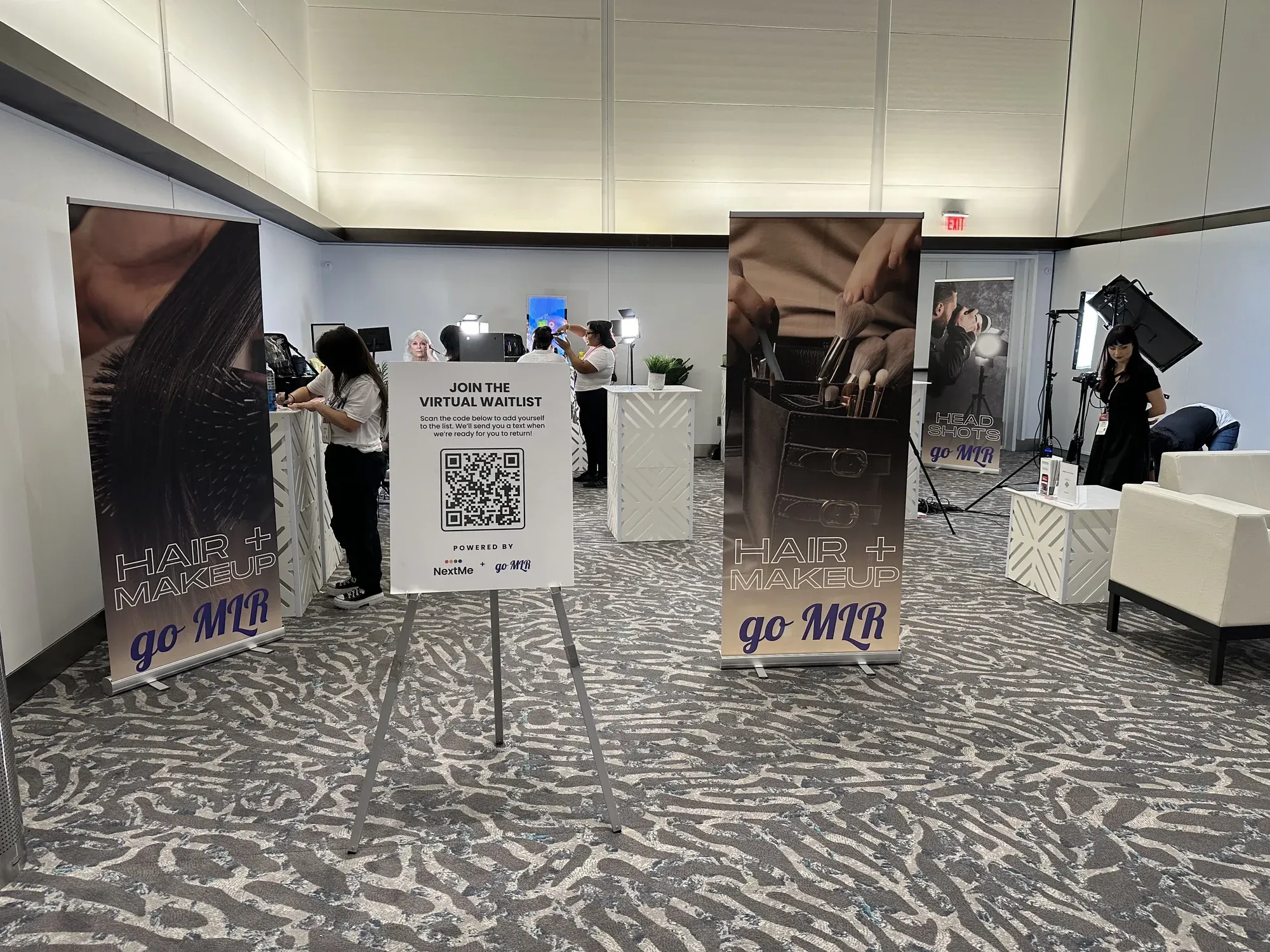 The goMLR Glam Bar at the BizBash summit, with a NextMe virtual waitlist QR sign at the entrance