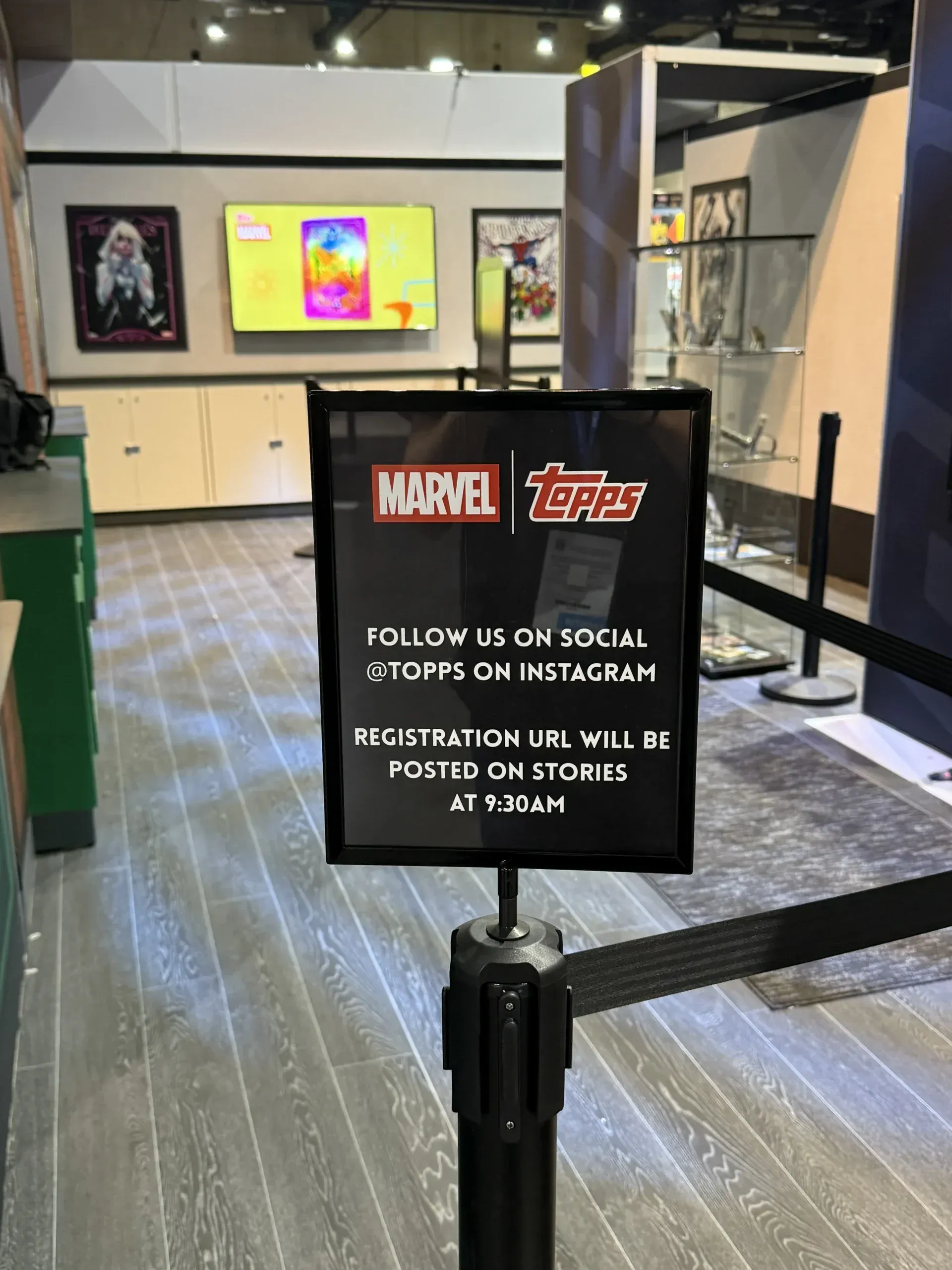 Sign at the Topps booth telling fans to follow Topps on Instagram, where the registration URL is posted