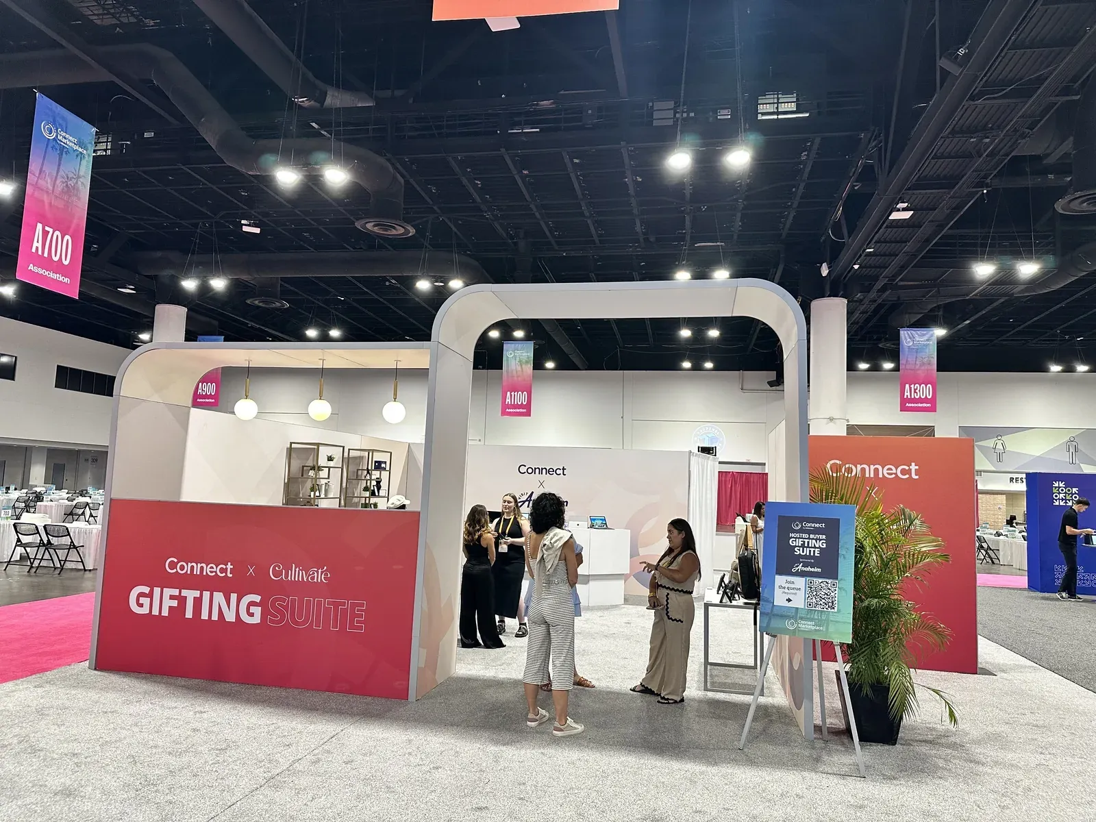 NextMe virtual queue signage at the Gifting Suite booth