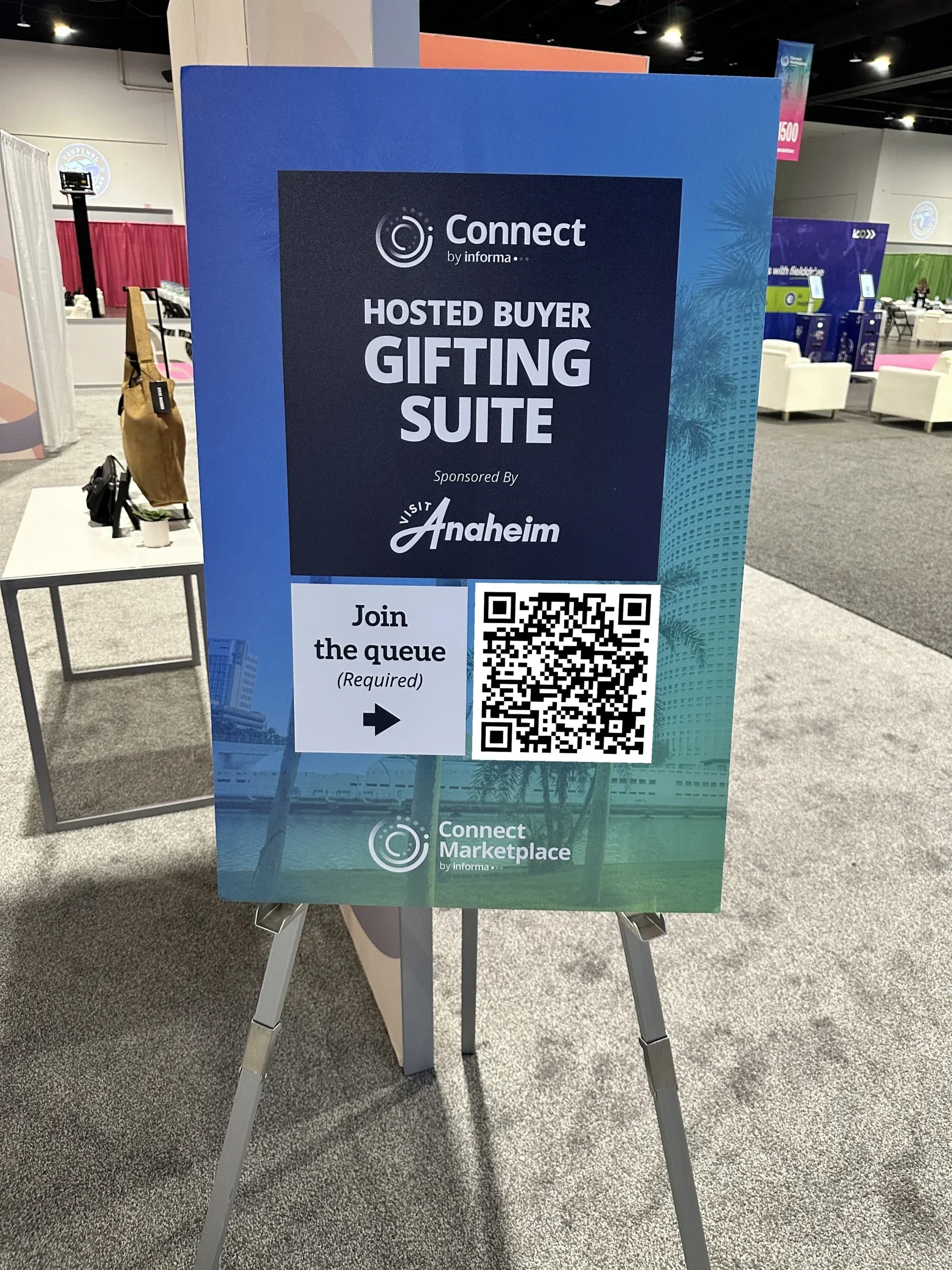A Hosted Buyer Gifting Suite sign with a QR code to join the NextMe queue