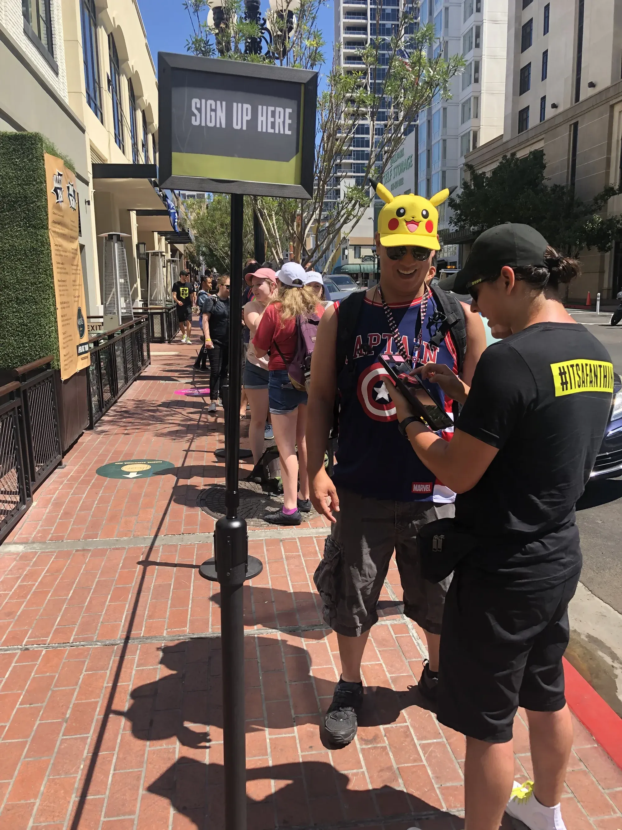 A SYFY staff member checking in a fan at the activation’s sign-up point