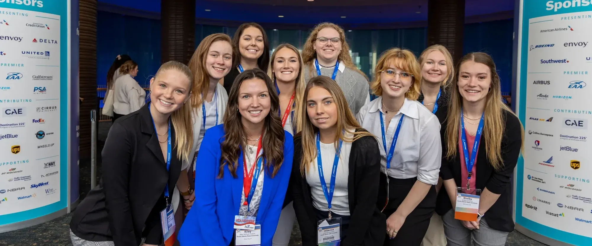 A group of attendees posing together at the Women in Aviation International 2025 Conference