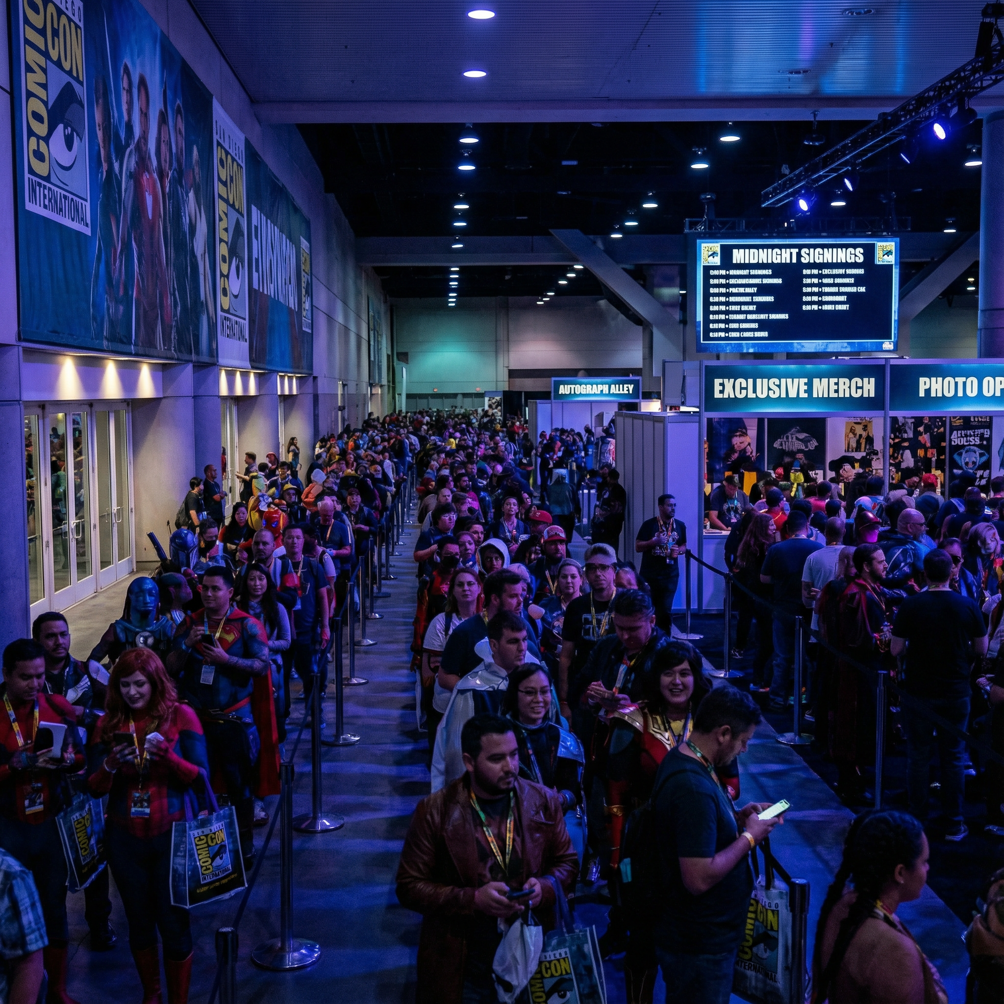 Long physical lines of attendees waiting inside a crowded San Diego Comic-Con.